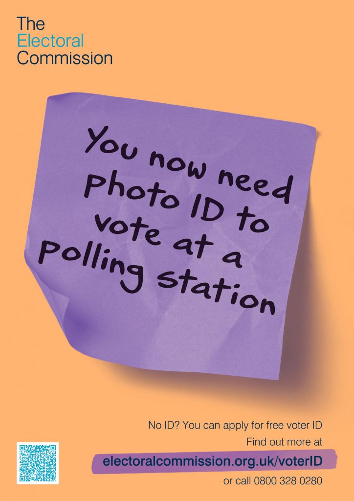 poster advertising the need for photo ID to vote at a poling station.